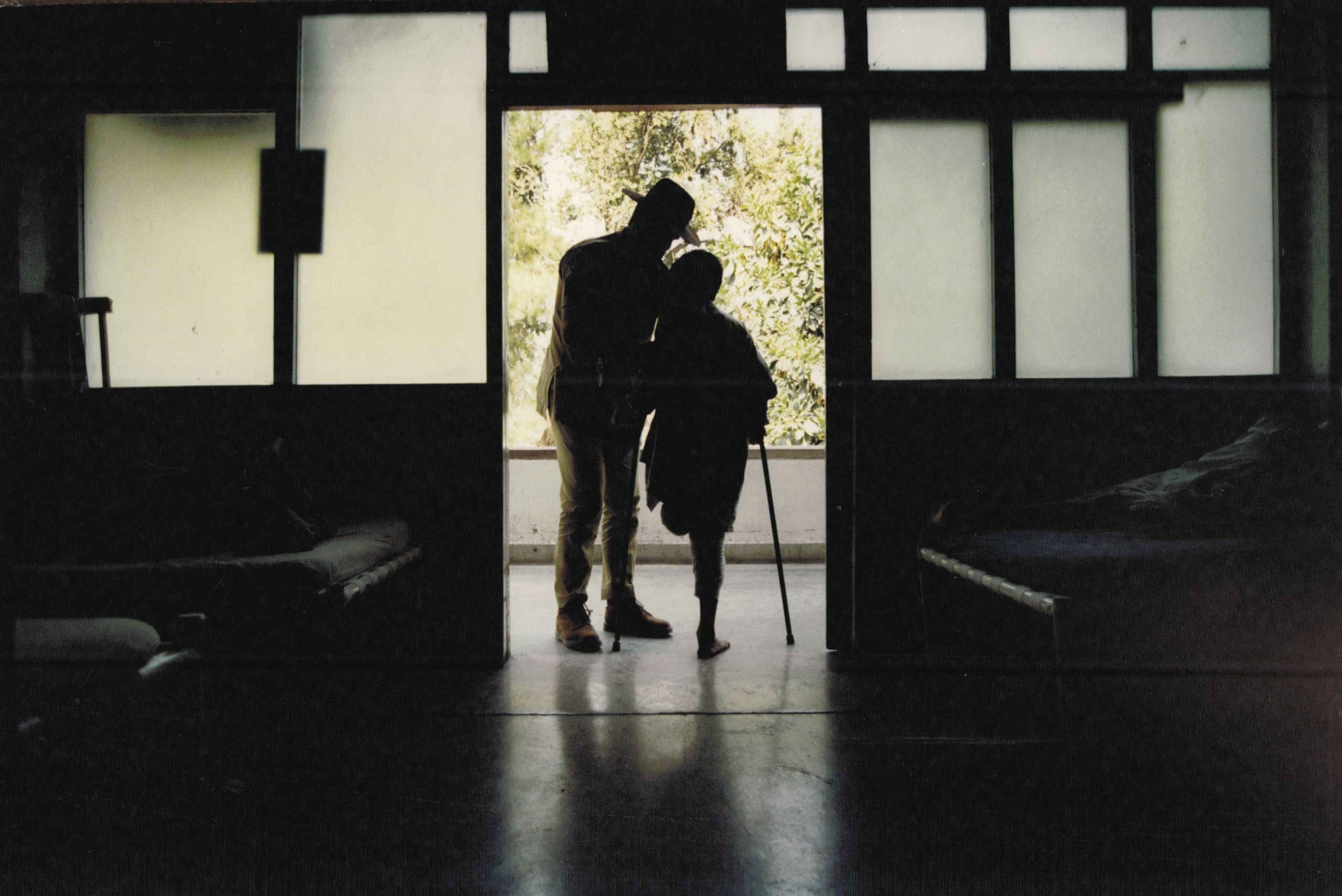 A young Afghani mine victim with Sergeant Mick Durnin