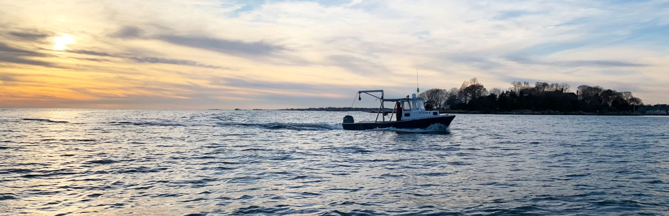 sunset with boat on water