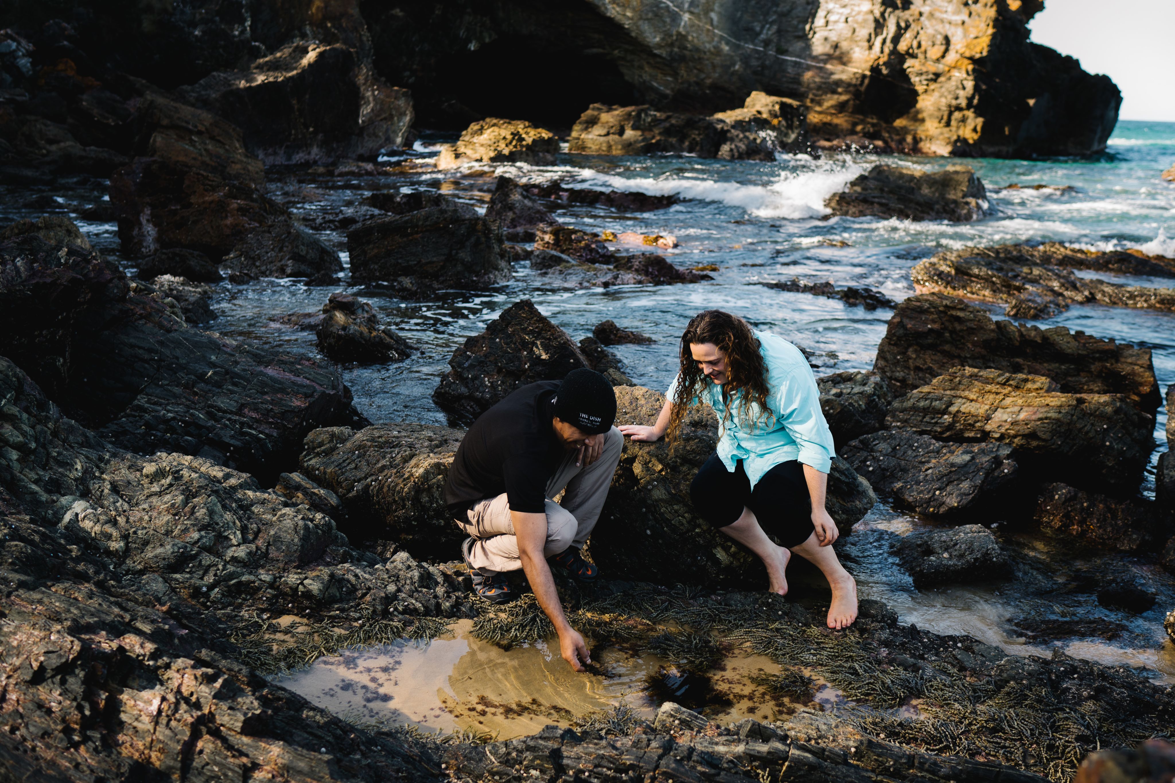 Sarah and James Thomas looking at seaweed between rocks